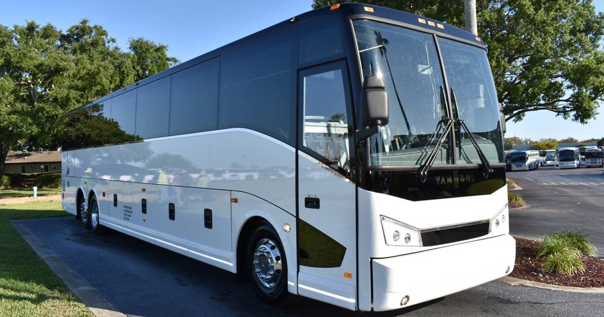 54 coach bus outside Monumental Tours Luxury Tour Bus